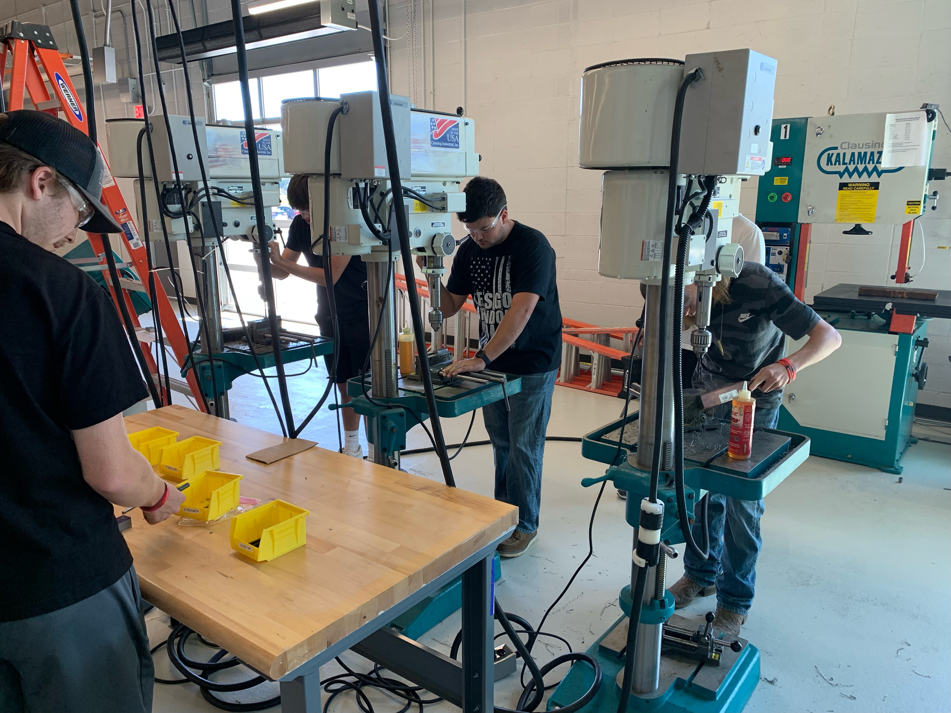 Students using machining equipment