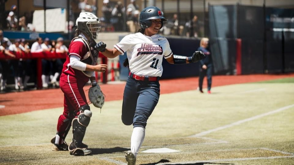 Chelsea Spain passing through home plate.