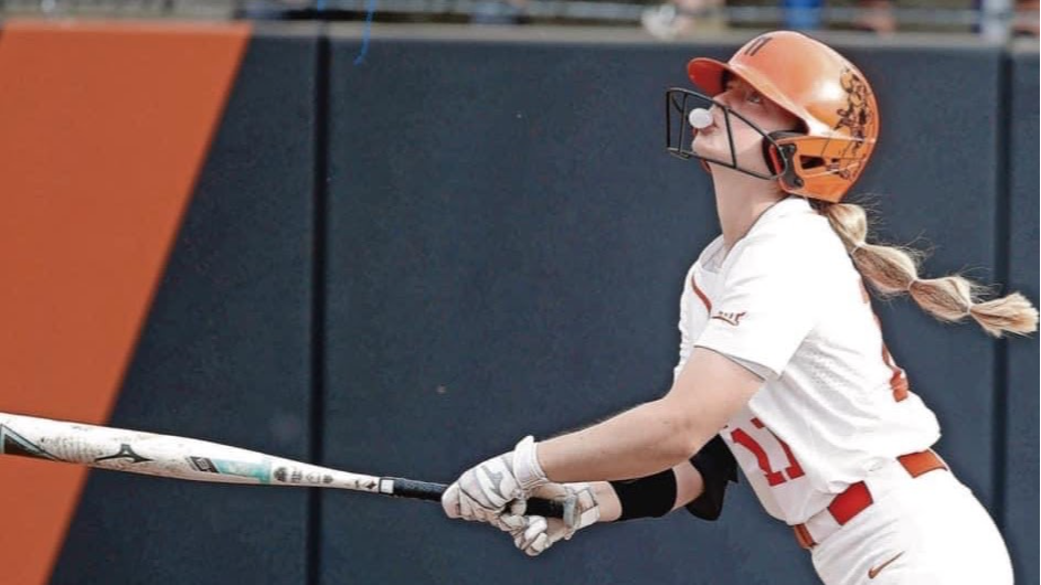 Katelynn Carwile with a softball bat