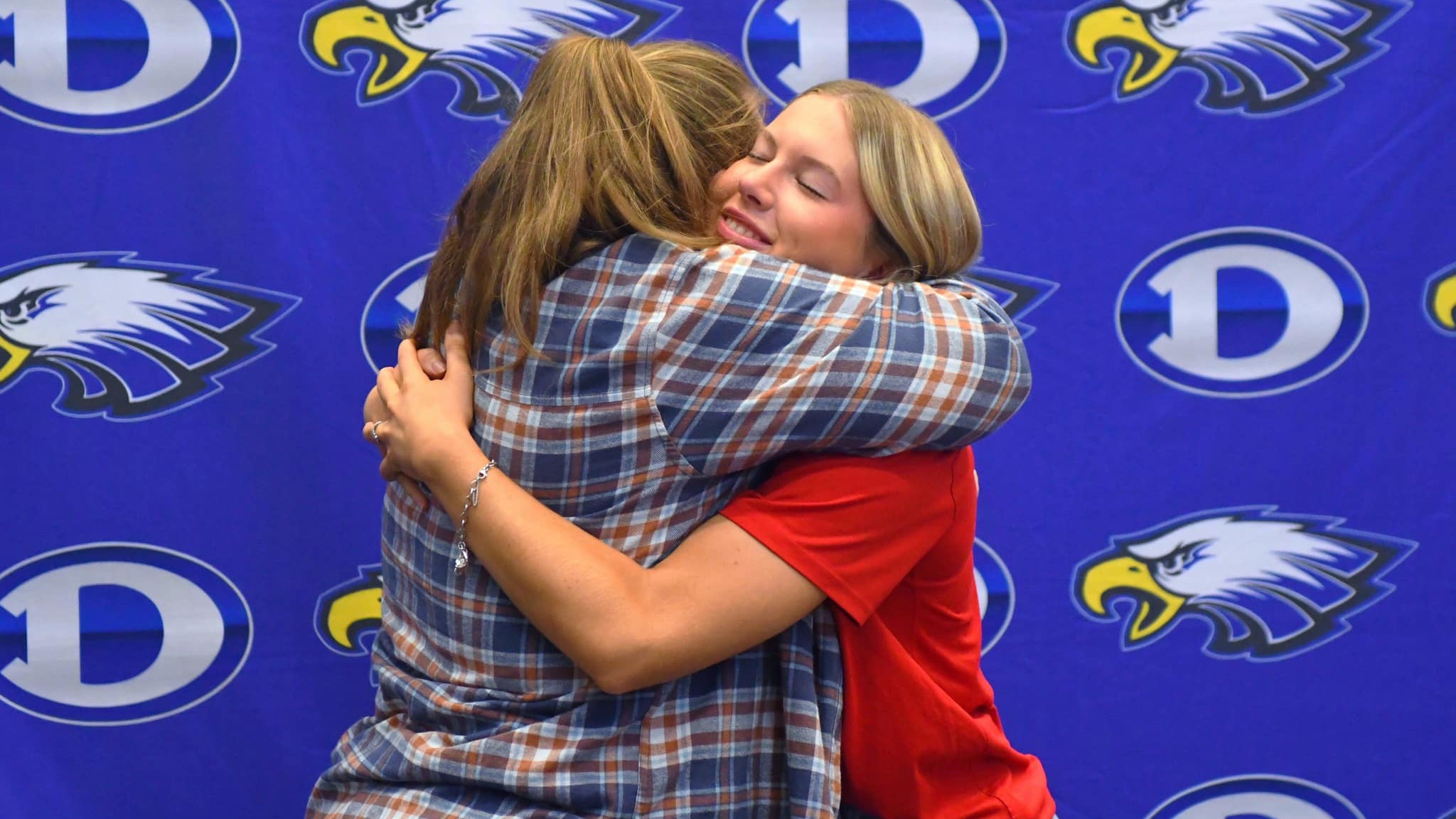 Two students hugging