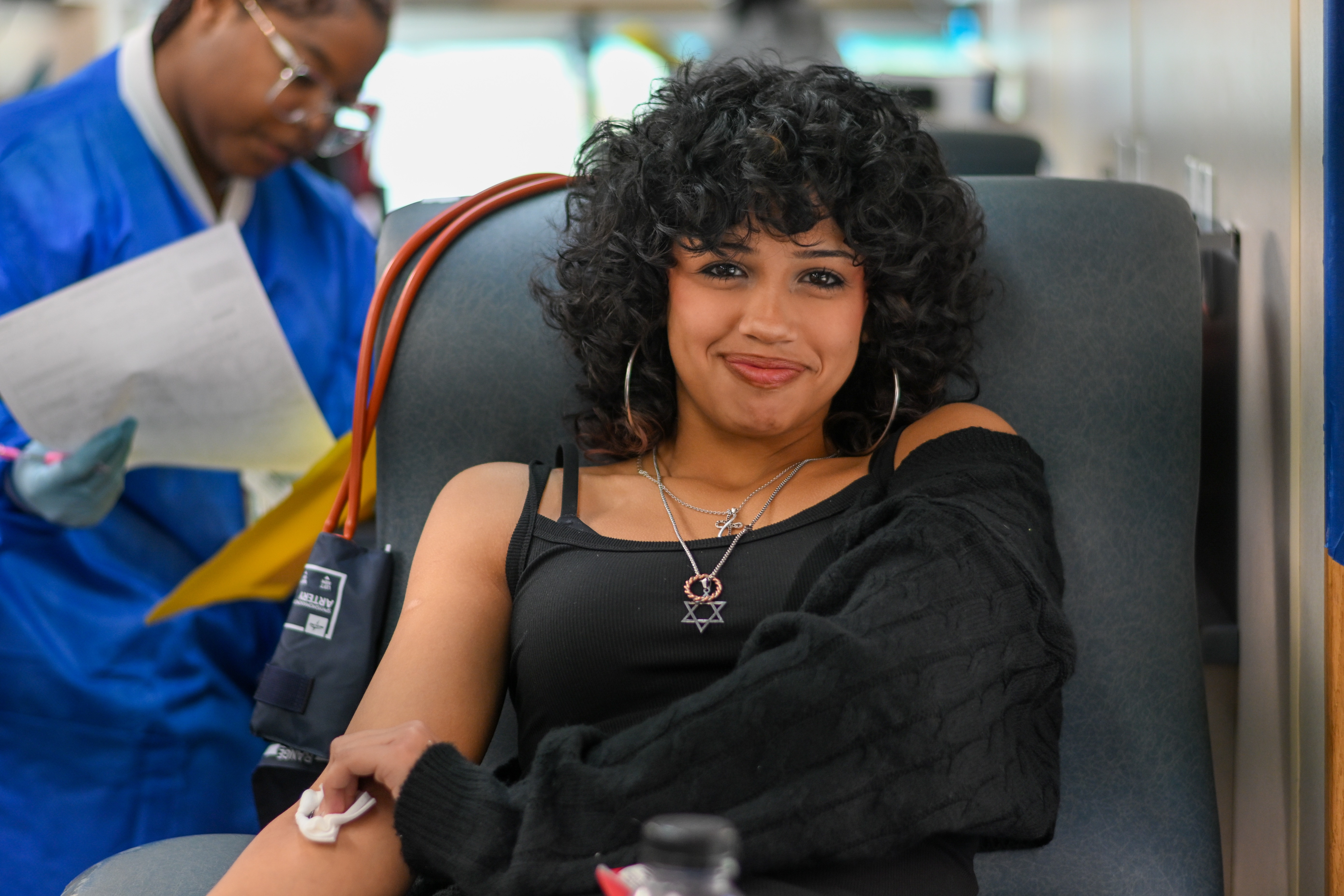 Photo of a student giving blood during a blood drive for Carter BloodCare