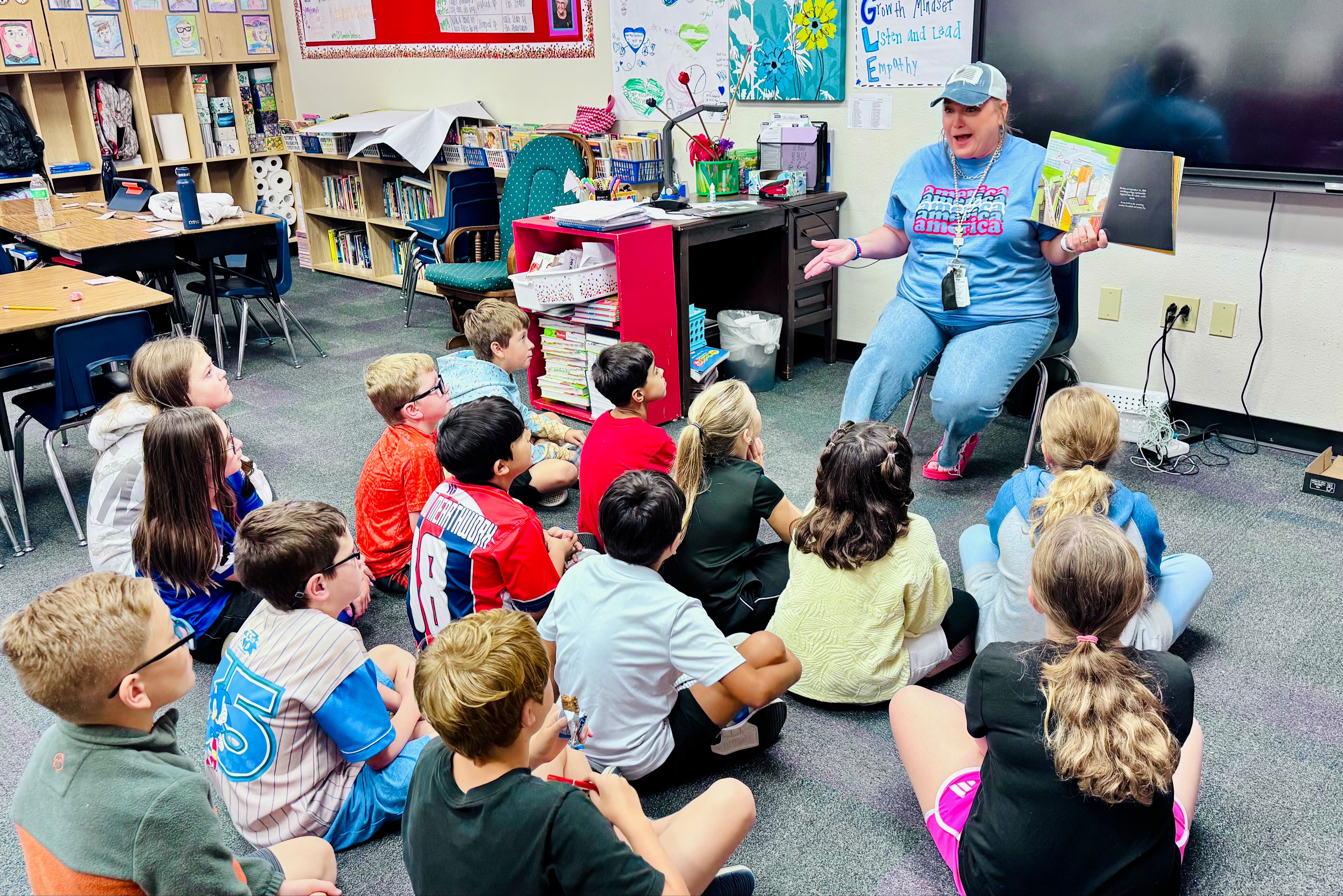 Photo of students reading a book during class