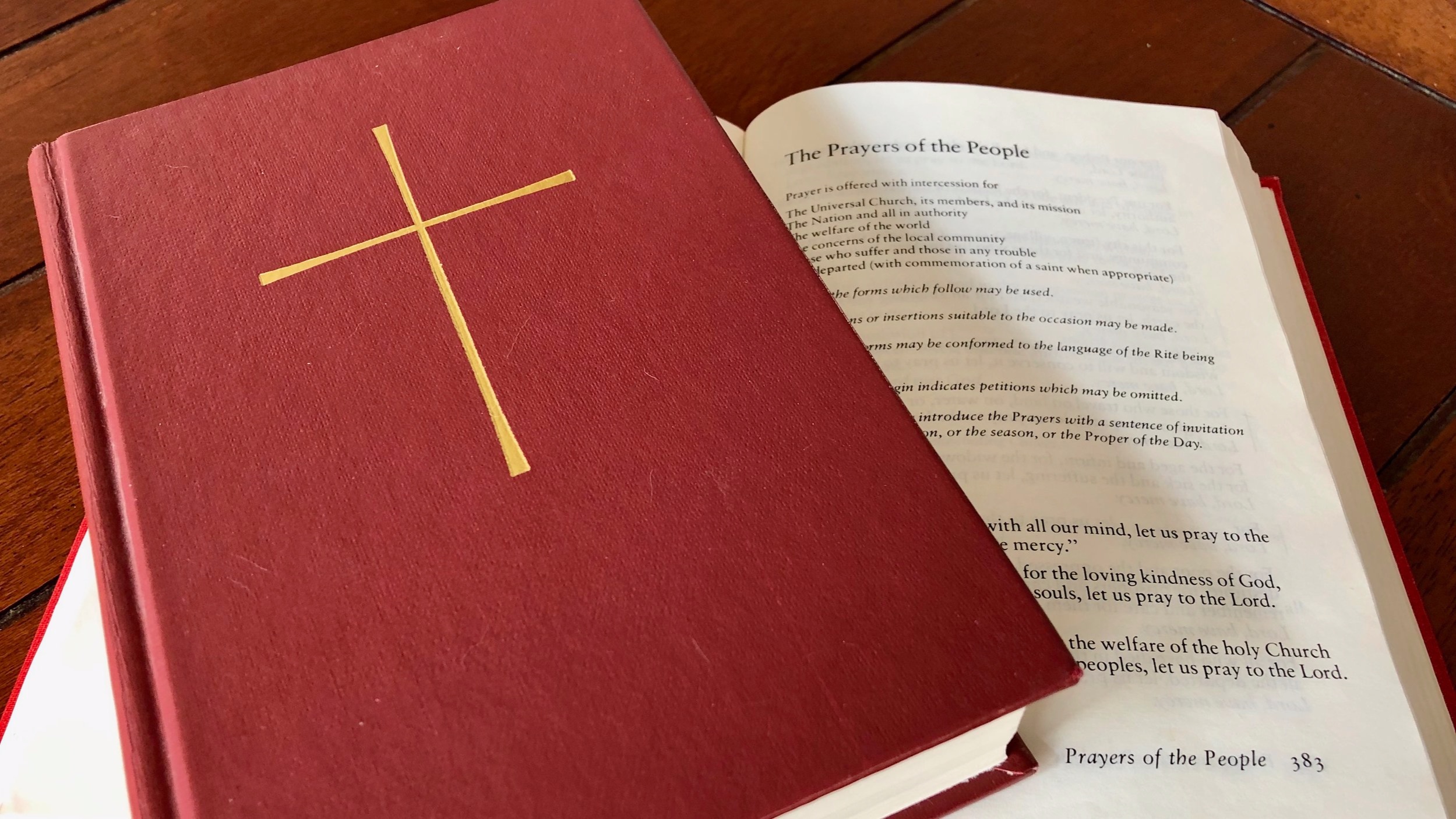 A bible stacked on top of an open bible