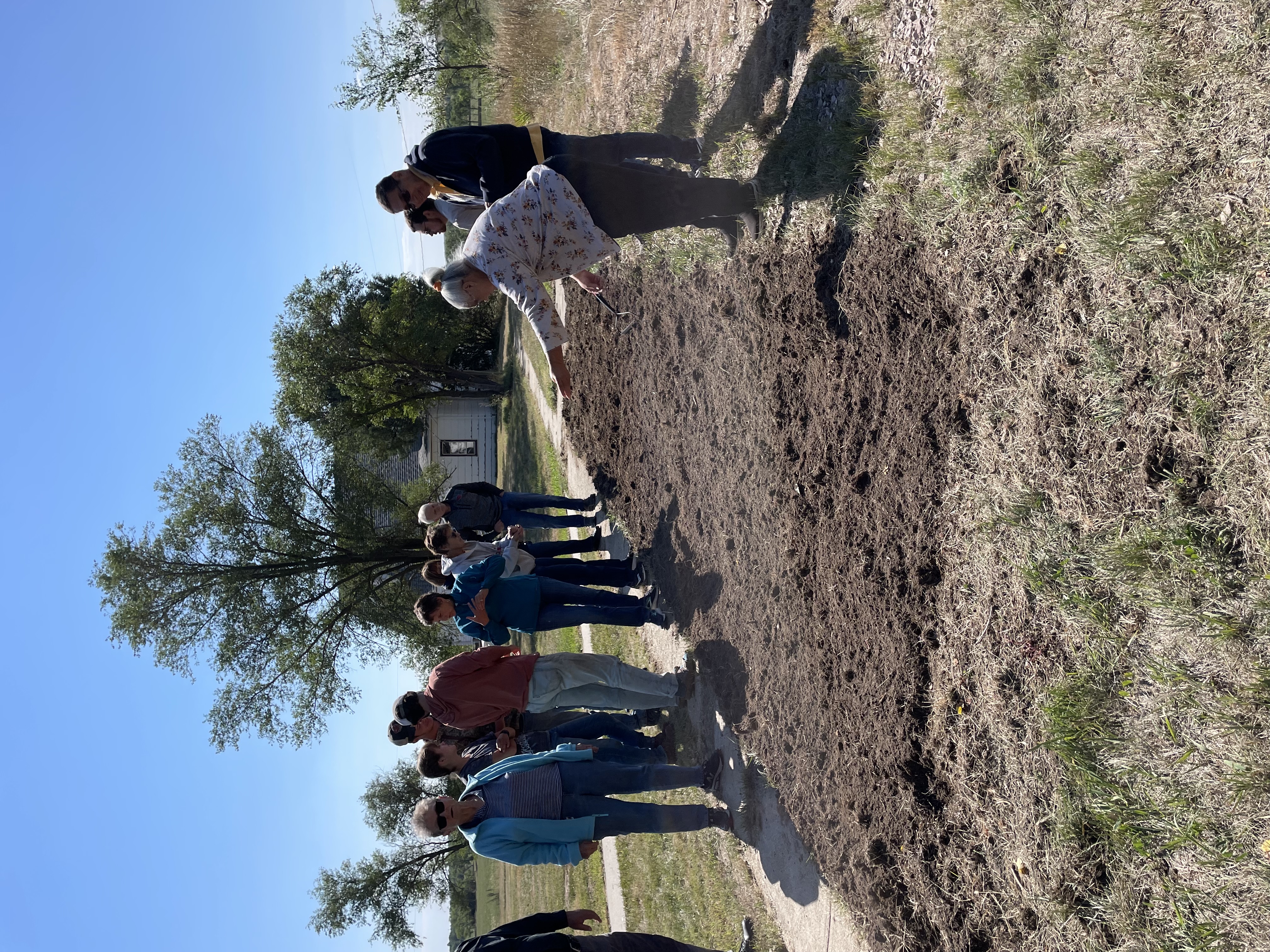 Deanna Stands planting at the Bishop Hare Center.