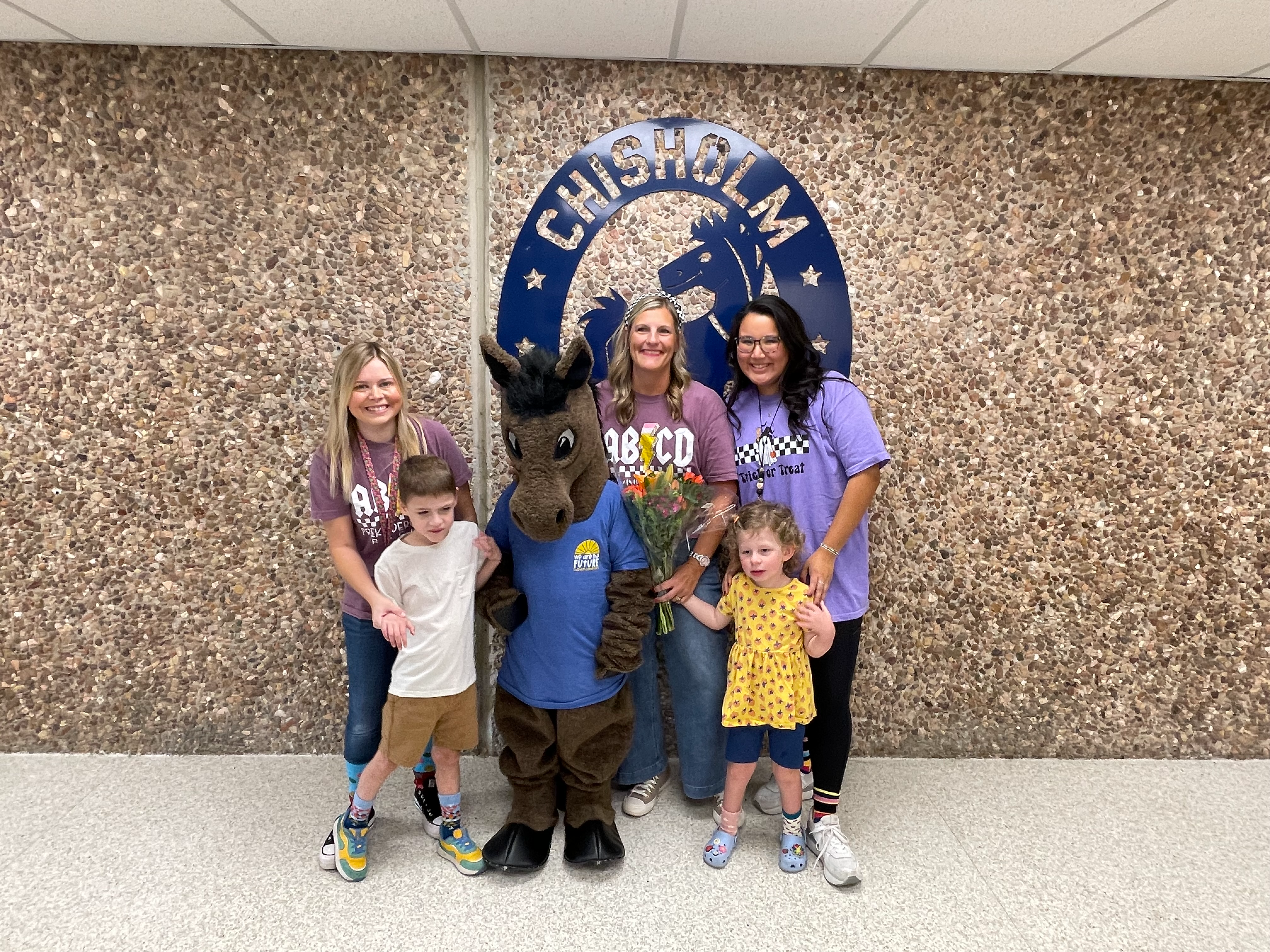 Leigh Cobb with Chargie, her students,  and her teacher assistants