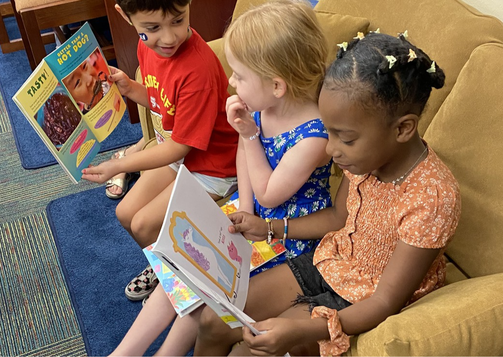 Students Reading together and looking at picture books