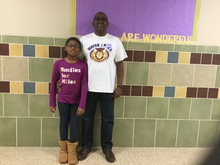 Mr. Hamilton with a student wearing a watch dogs t shirt