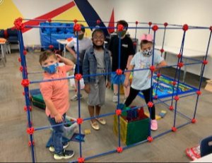 Kids Playing in toy climbing structure