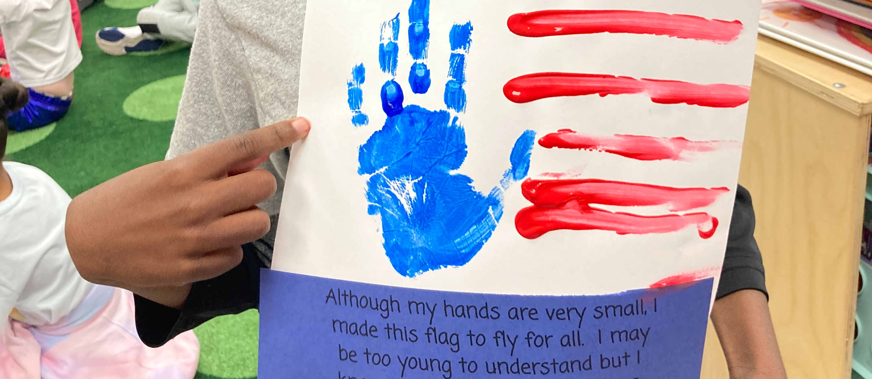 student with hand painted flag