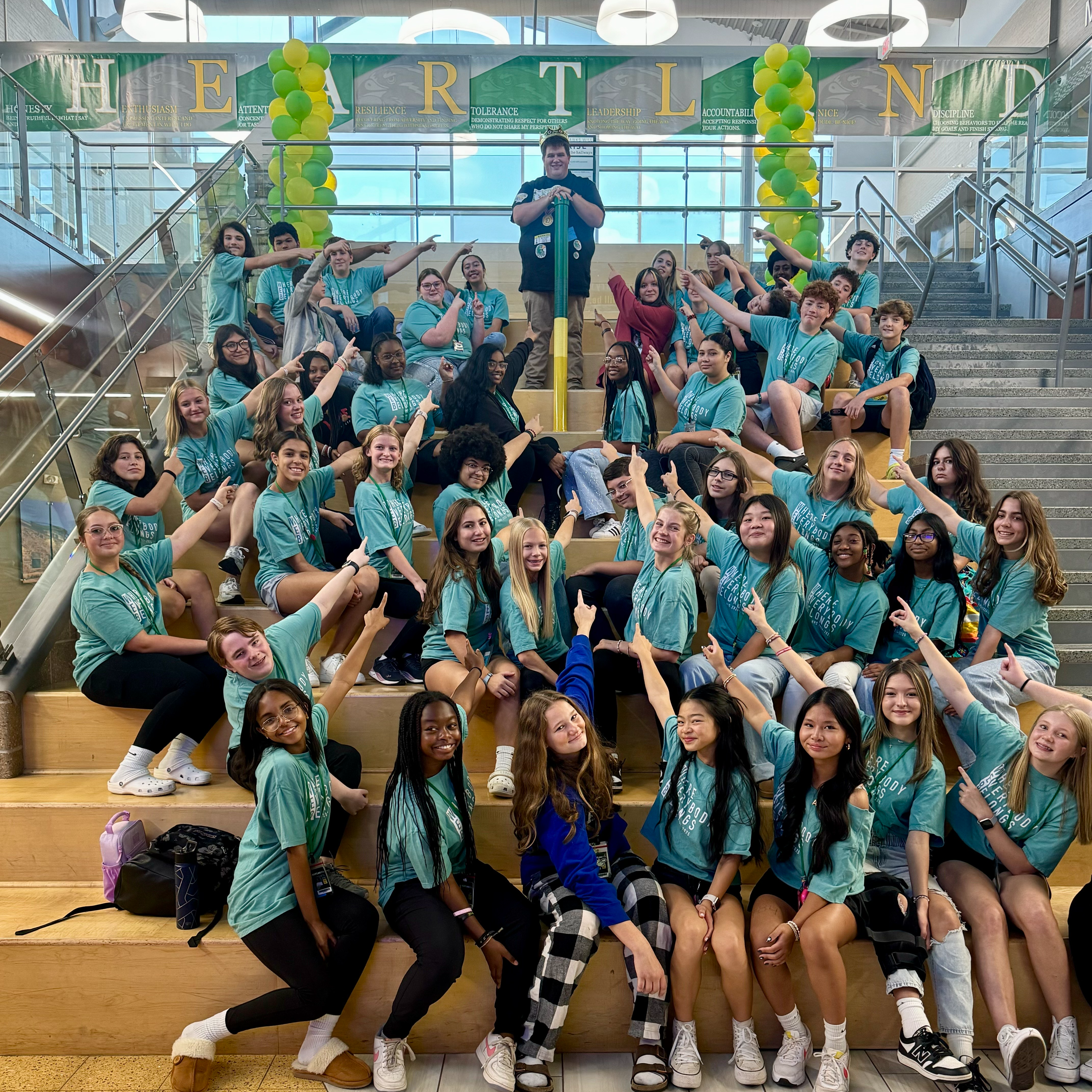 Teacher of the Year posing with students