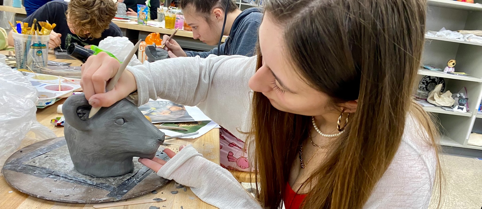 art students work on clay projects