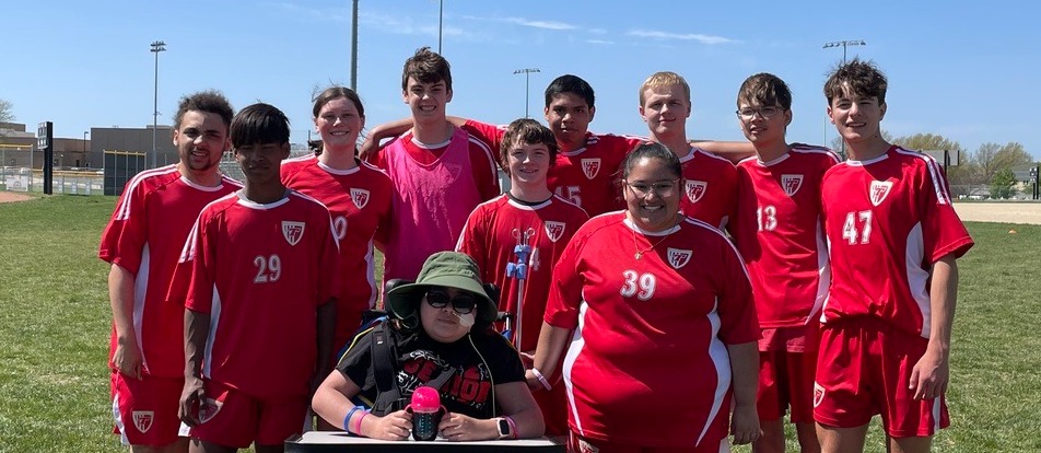 Unified Soccer team members pose together on the soccer field