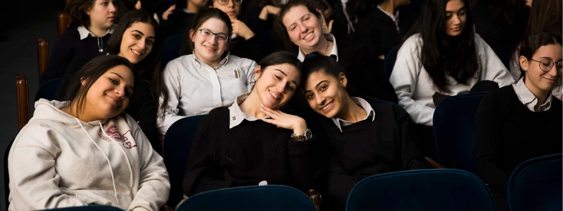 image of students sitting together