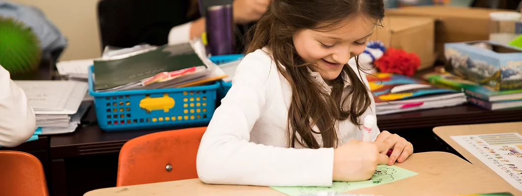 student coloring a drawing
