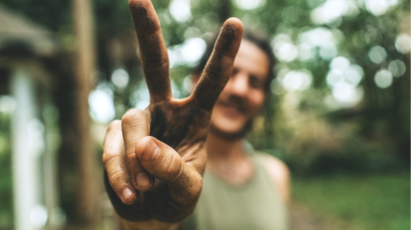 man holding up two fingers