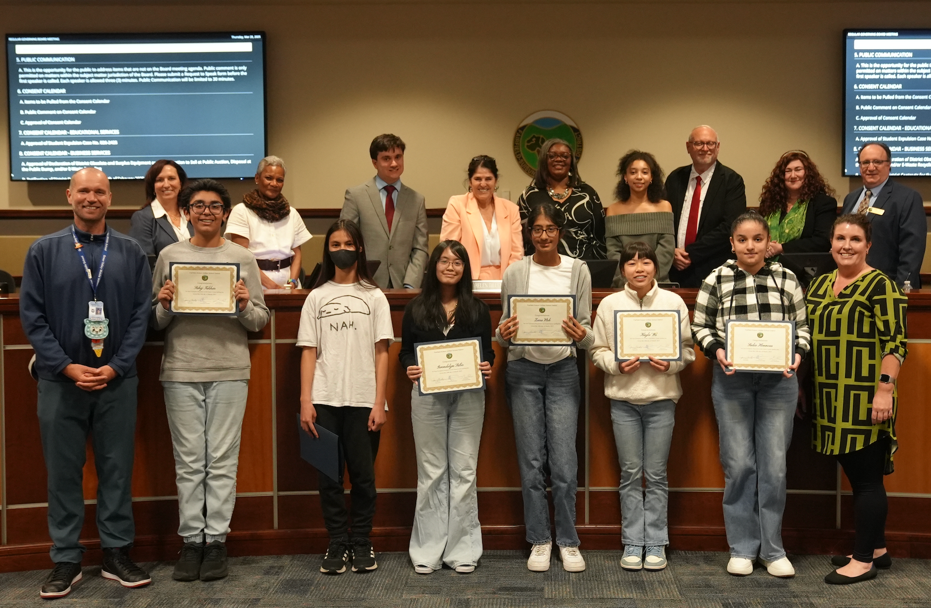Governing Board Members and student of the months taking a photo