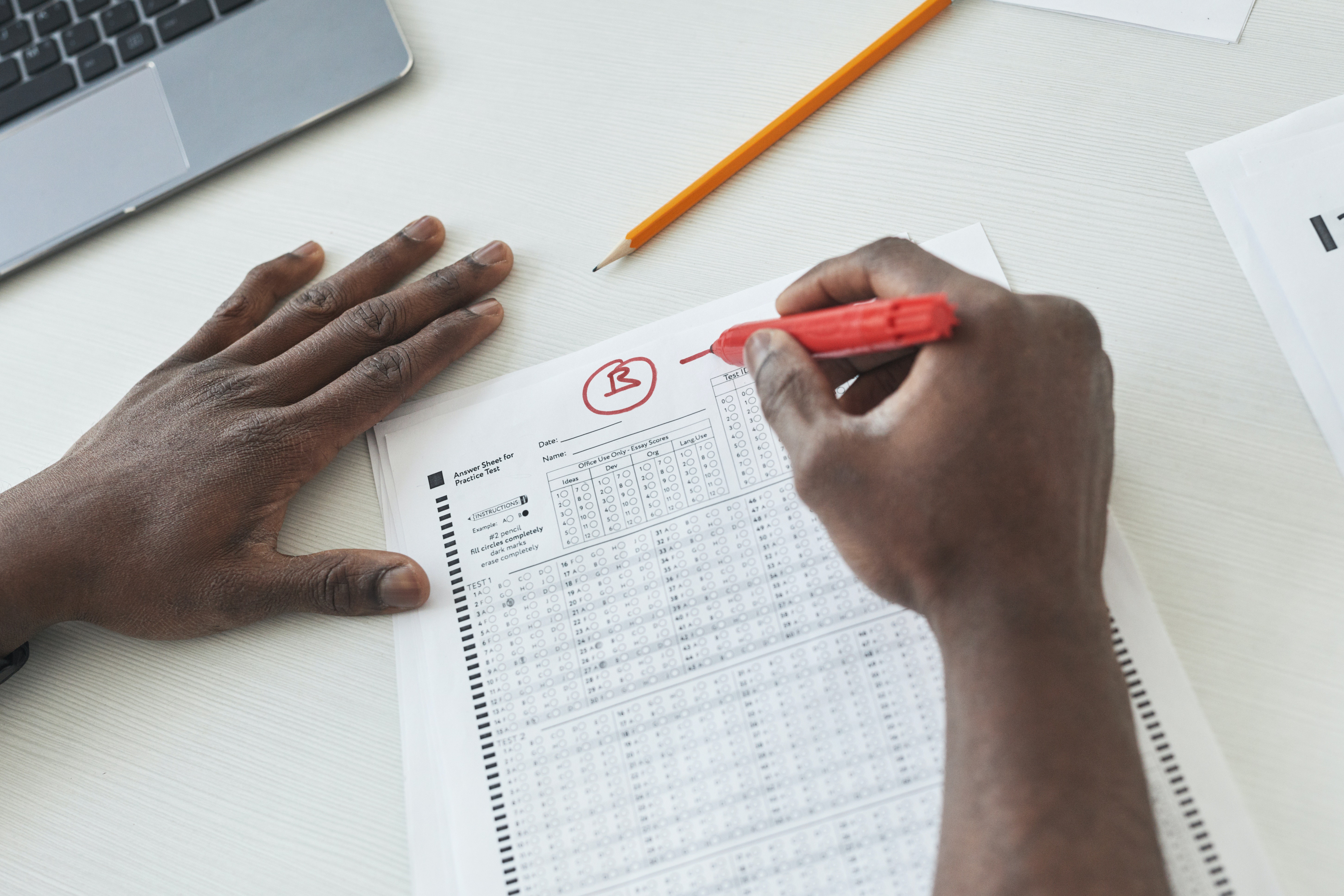 An image of a test sheet with a B written on the top in red to indicate that the student received a B on the assignment. 