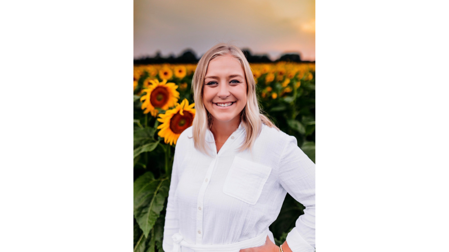 Abigail Hlinka in a field of sunflowers