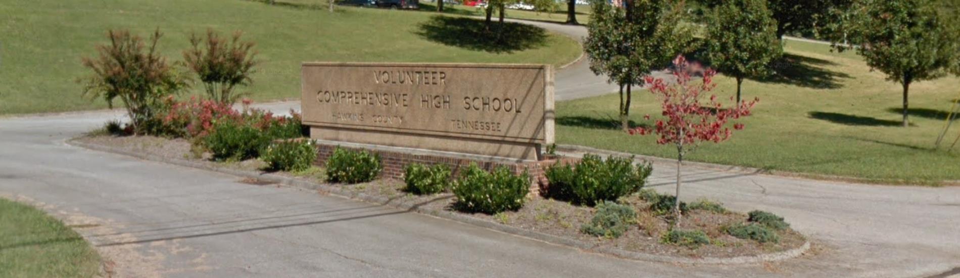 concrete sign for Volunteer High School in front of building