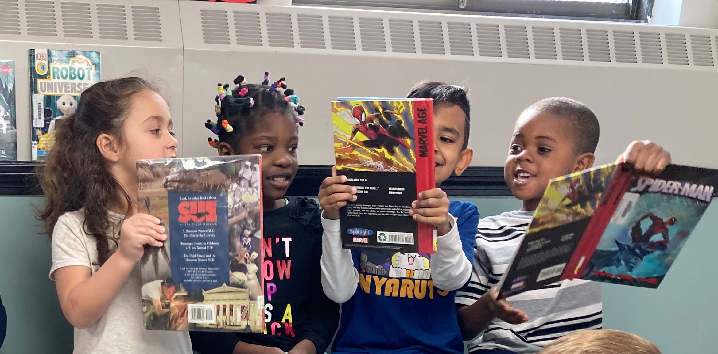 children reading together and laughing