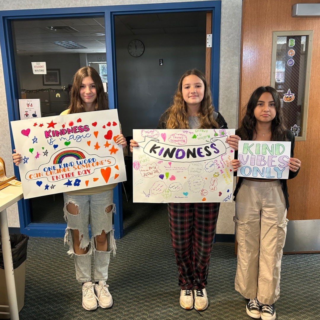 studnets on kindness day with signs