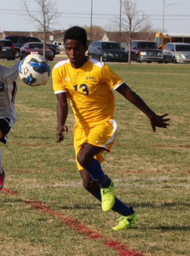 boy playing soccer