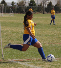 girl playing soccer