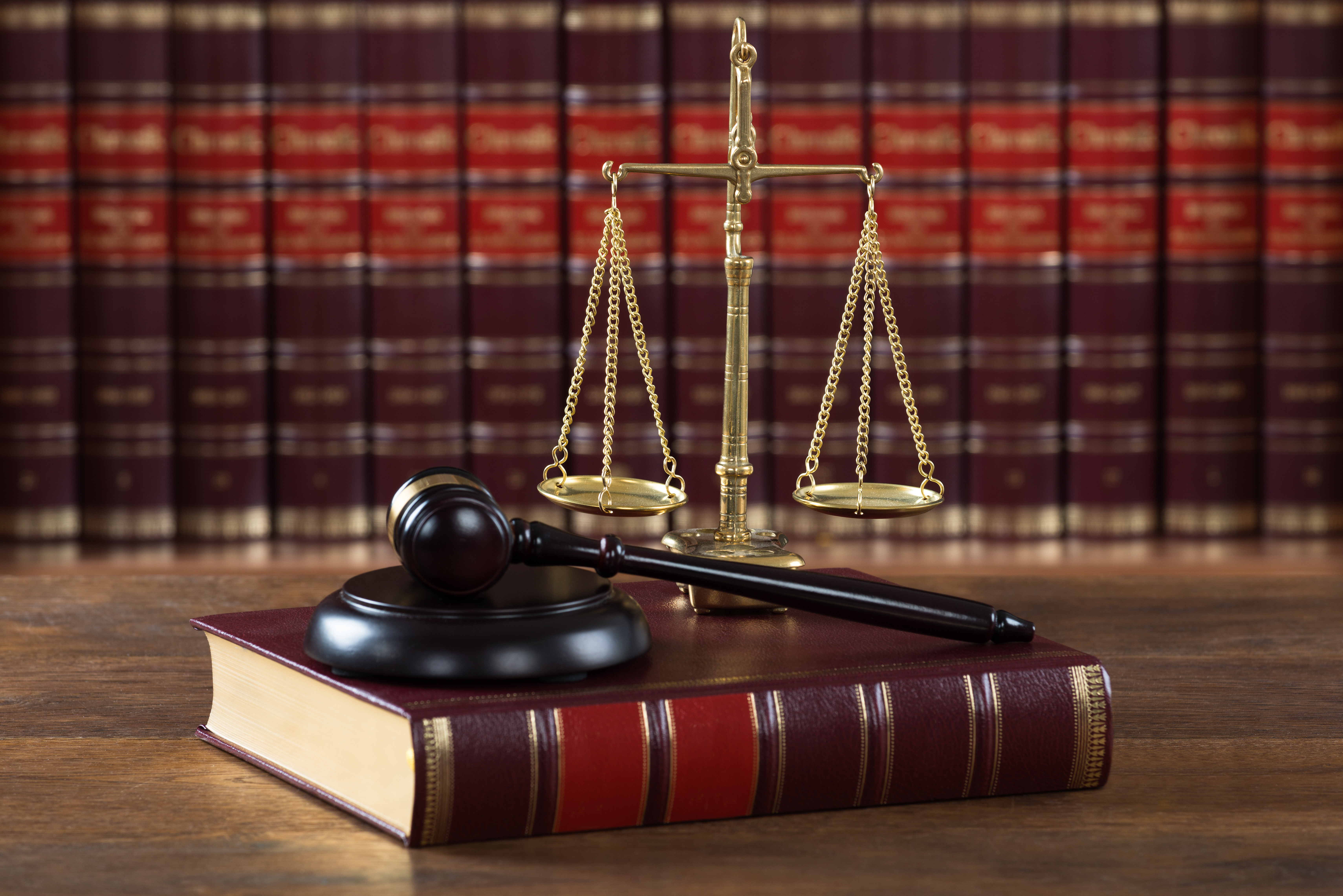 Law book, gavel, and scales of justice
