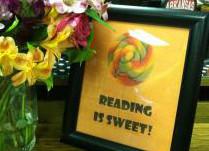 sign saying reading is sweet