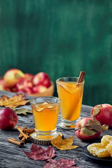 apples and juice on a table