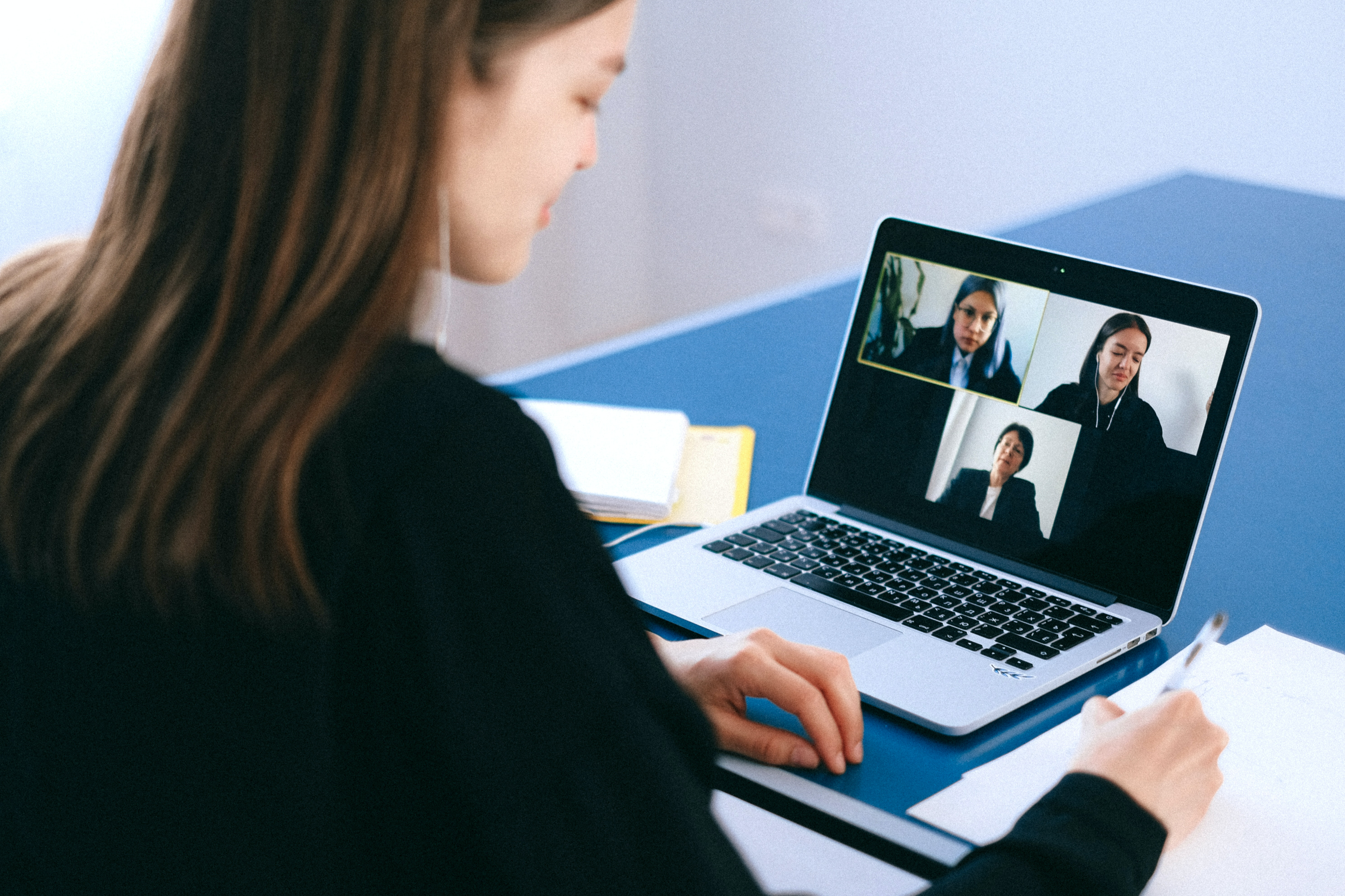 person on a virtual meeting with two other people