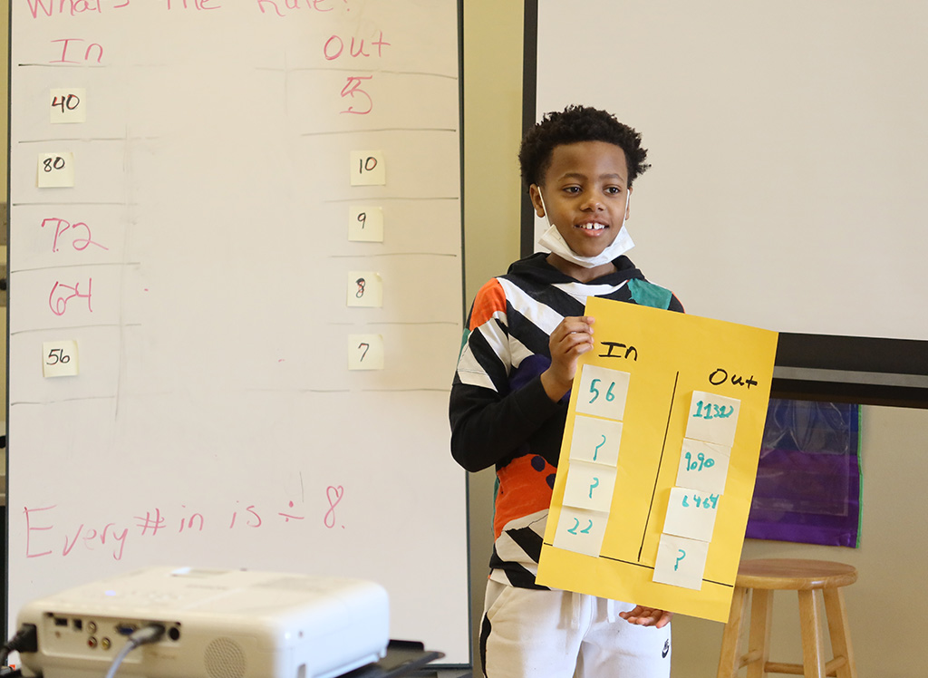 student holding a poster