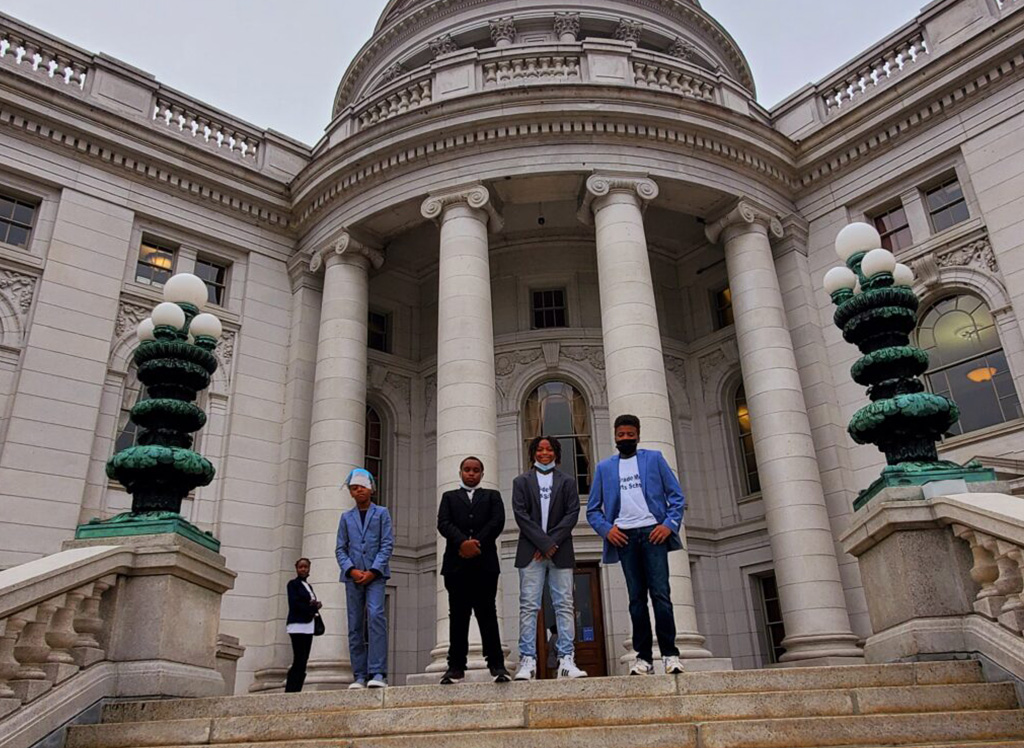 Students standing outside of an important building