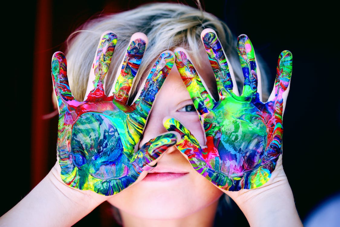 boy with painted hands