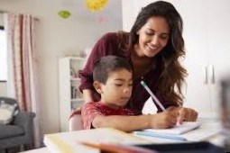 mother and son doing homework together