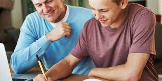 father and son dong homework together
