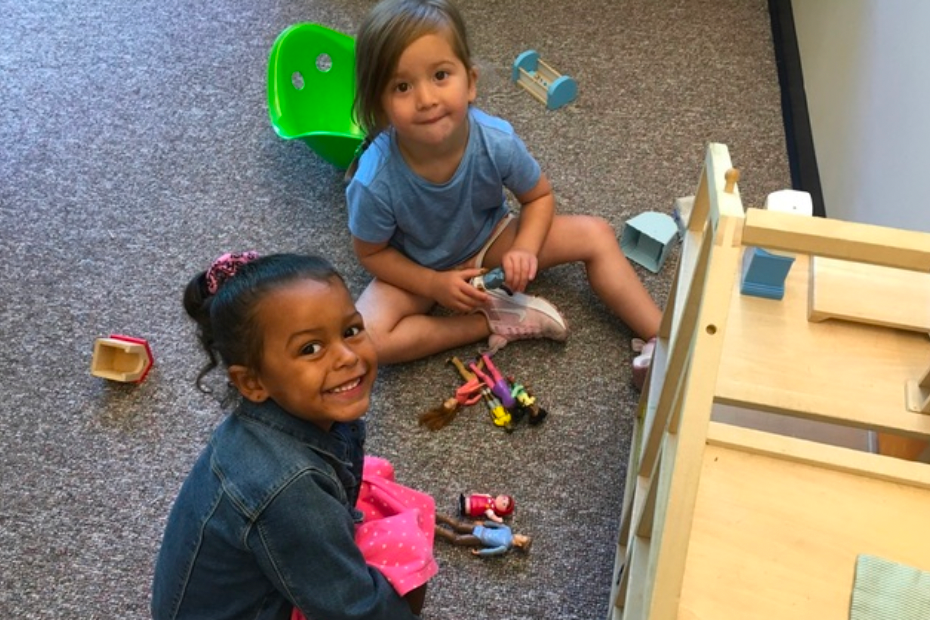 children playing with dollhouse