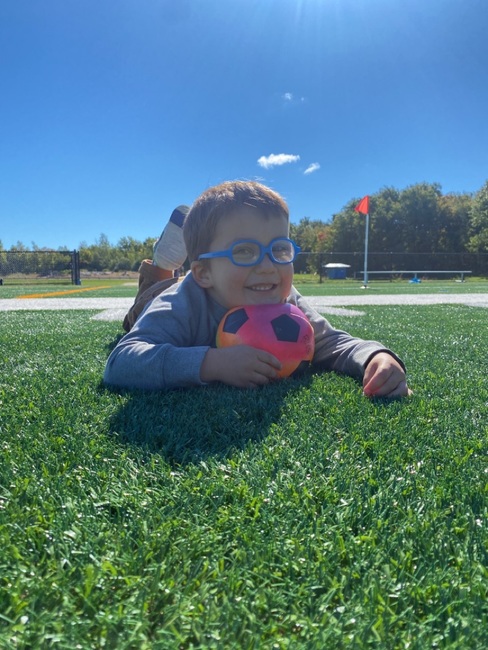 child in grass