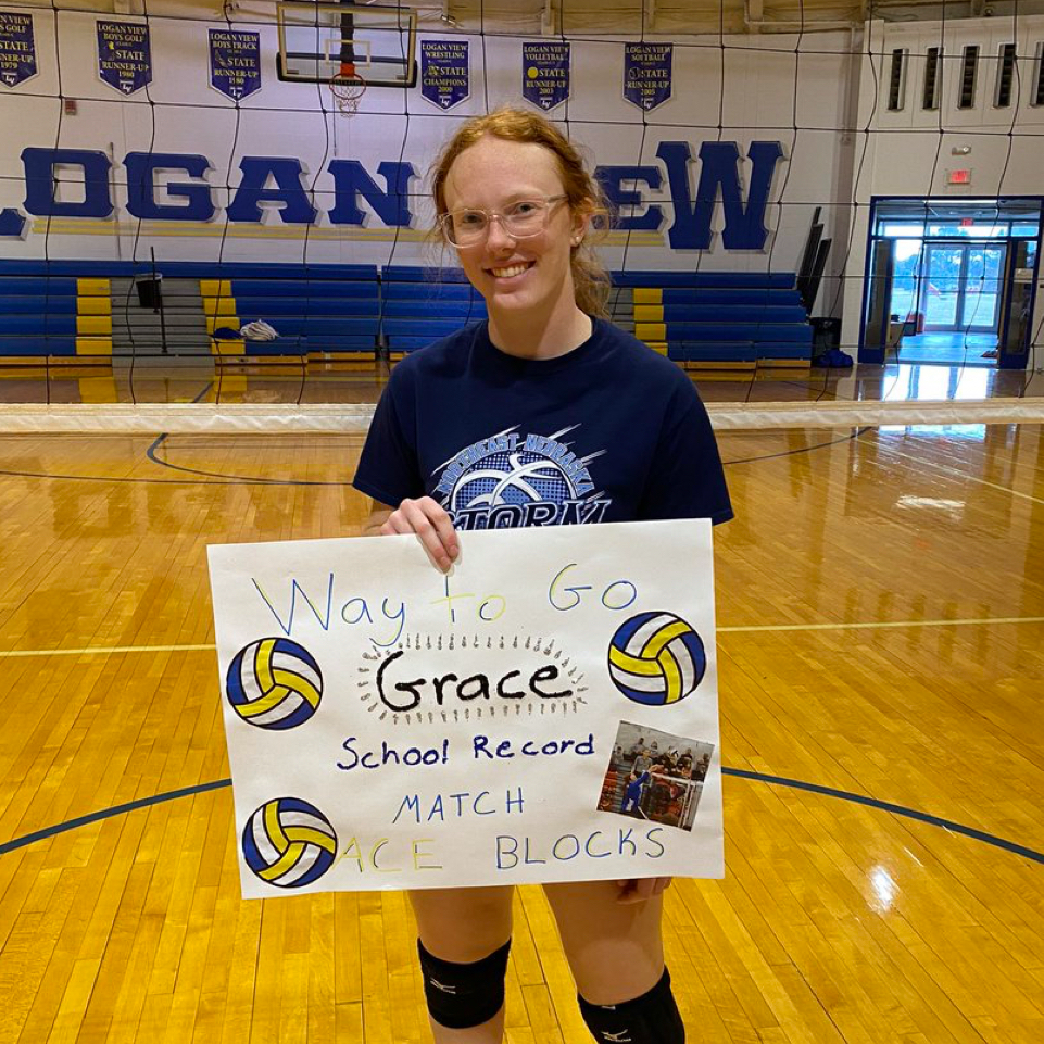 volleyball girl holding sign