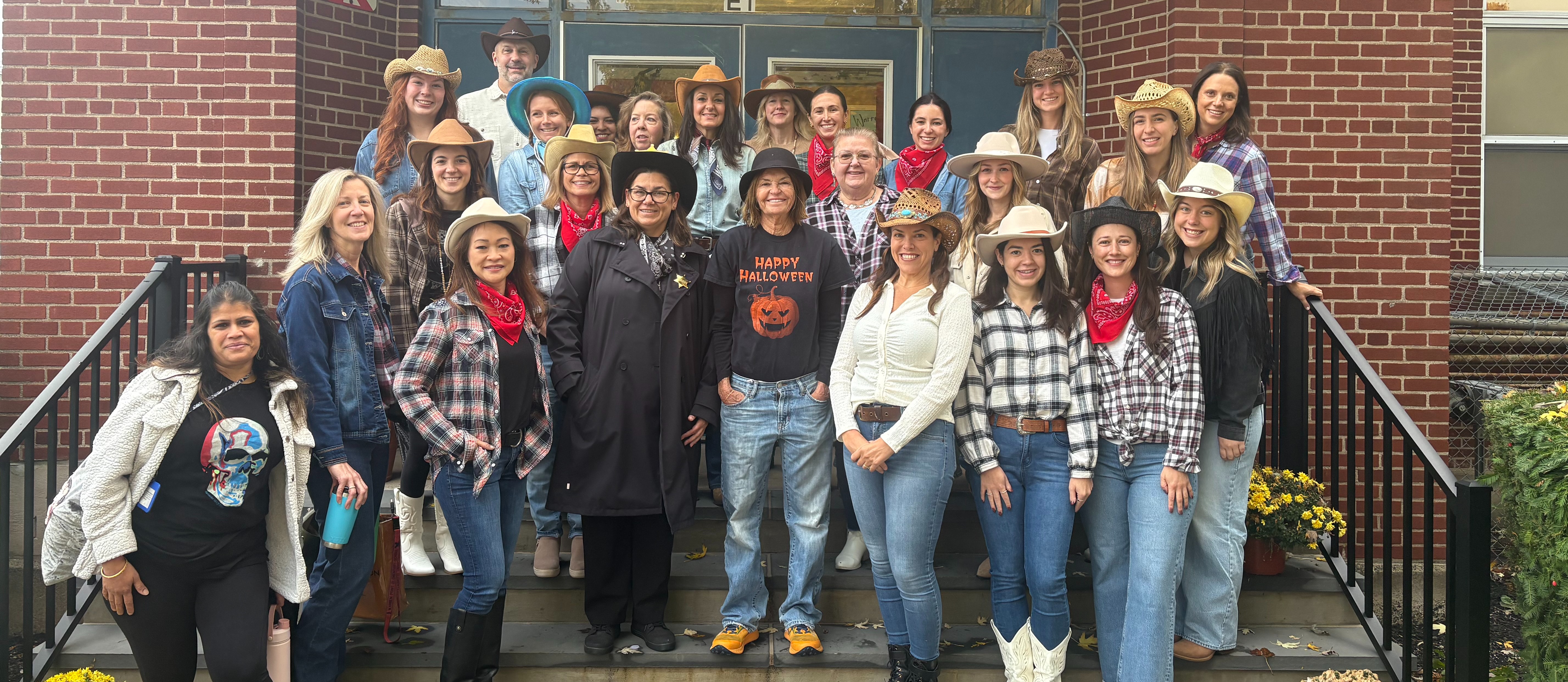 staff dressed as cowboys for halloween