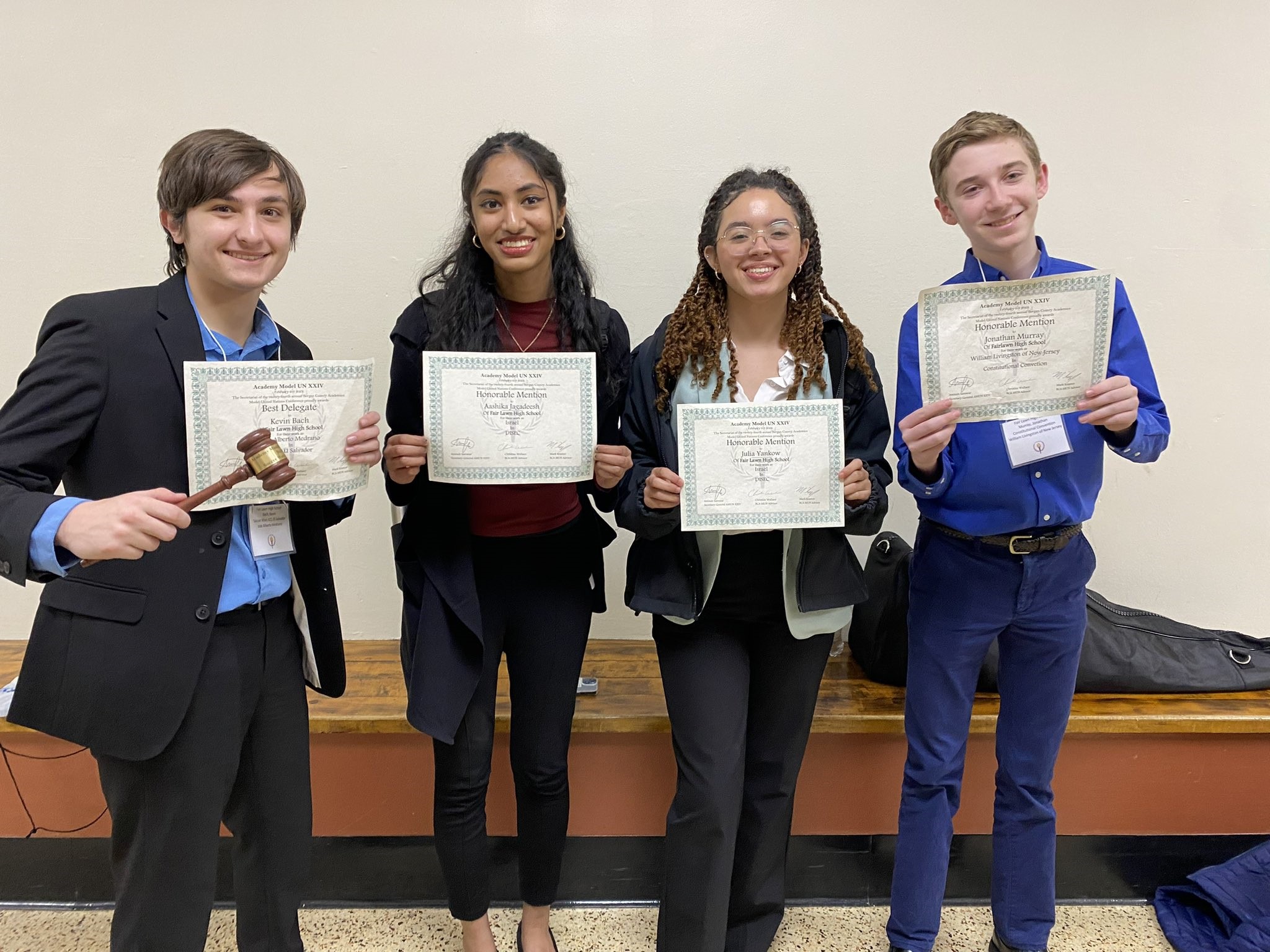 students holding certificates