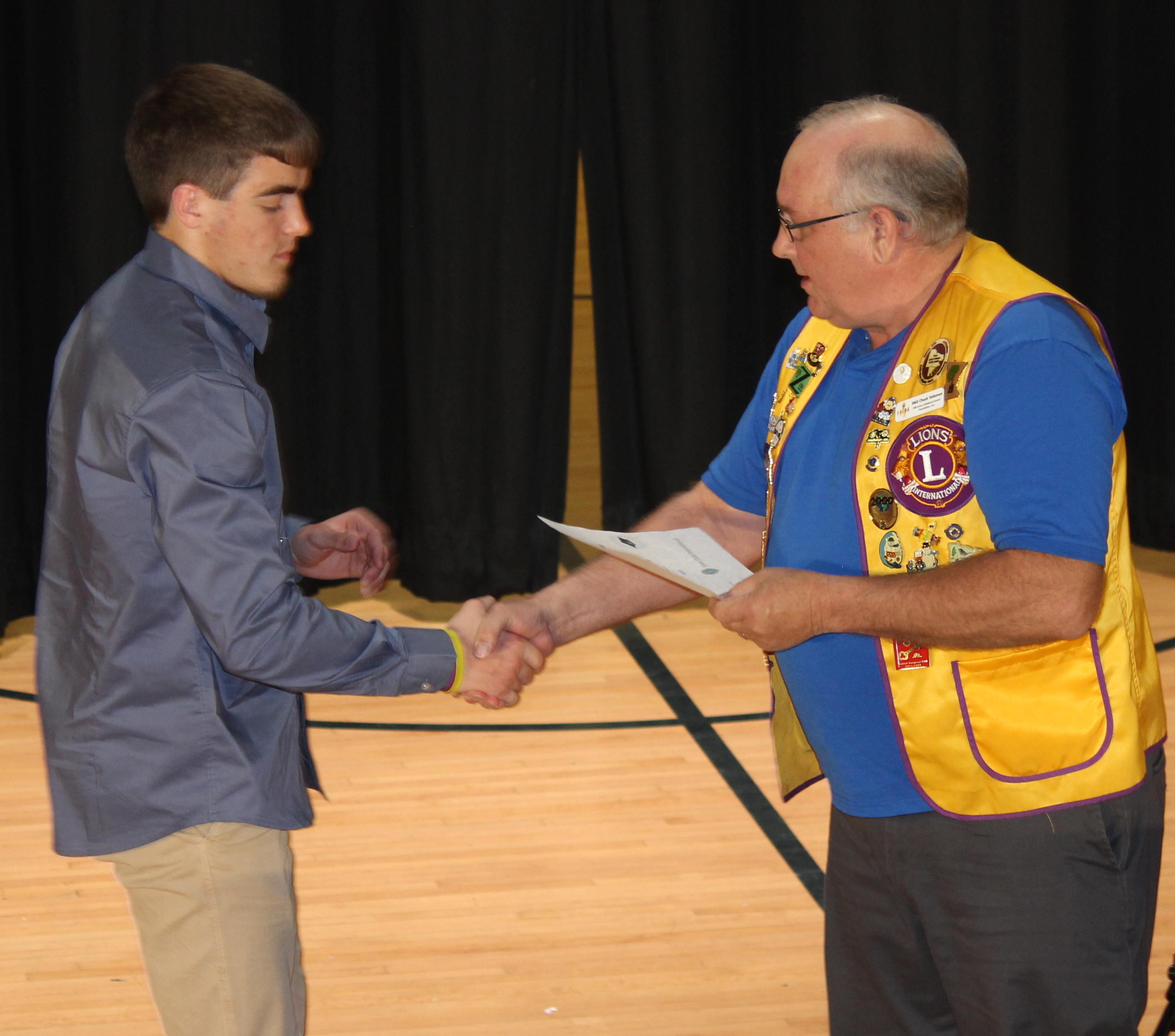 Student receiving community scholarship