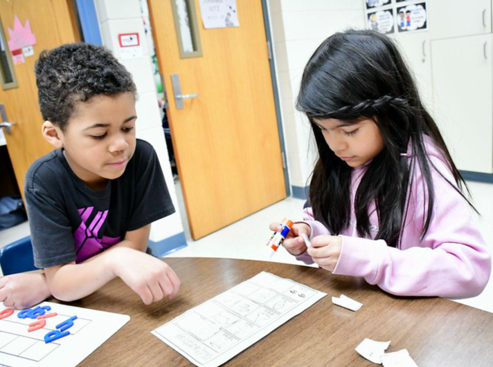 Elementary students working on a project