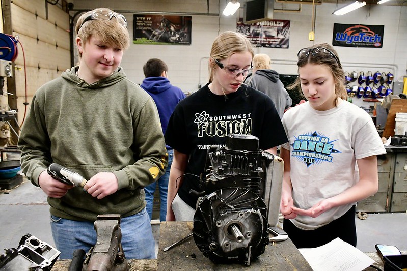 Students working on an engine