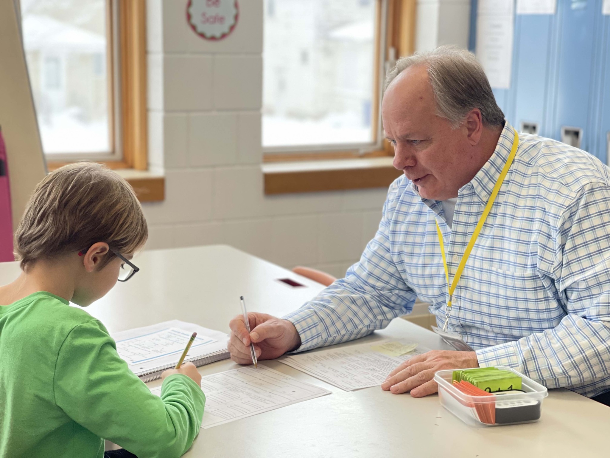 Teacher working with student