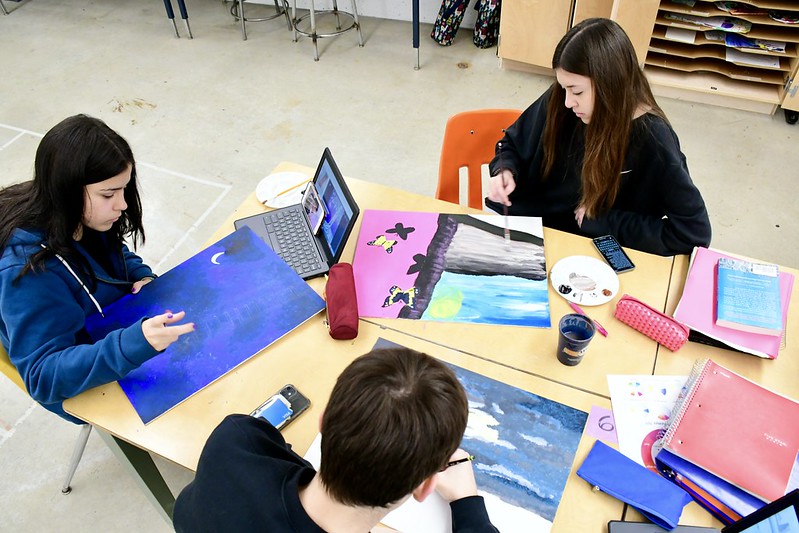 Students painting in art class