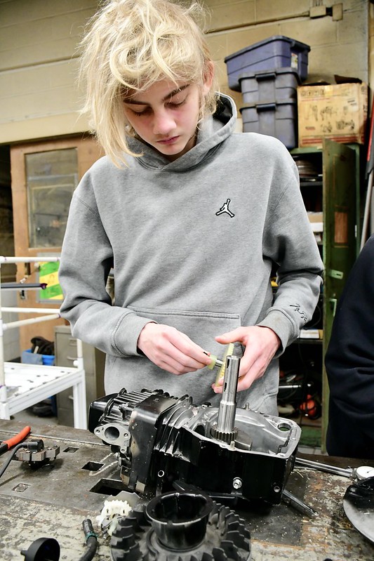 Student working on an engine