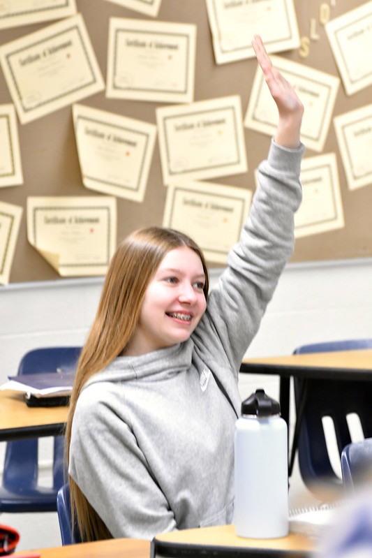 Student raising her hand
