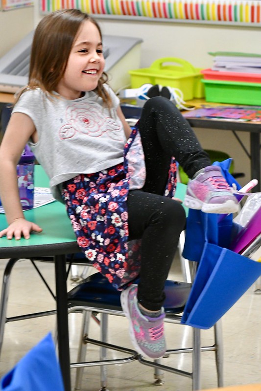 Student with her foot on a desk