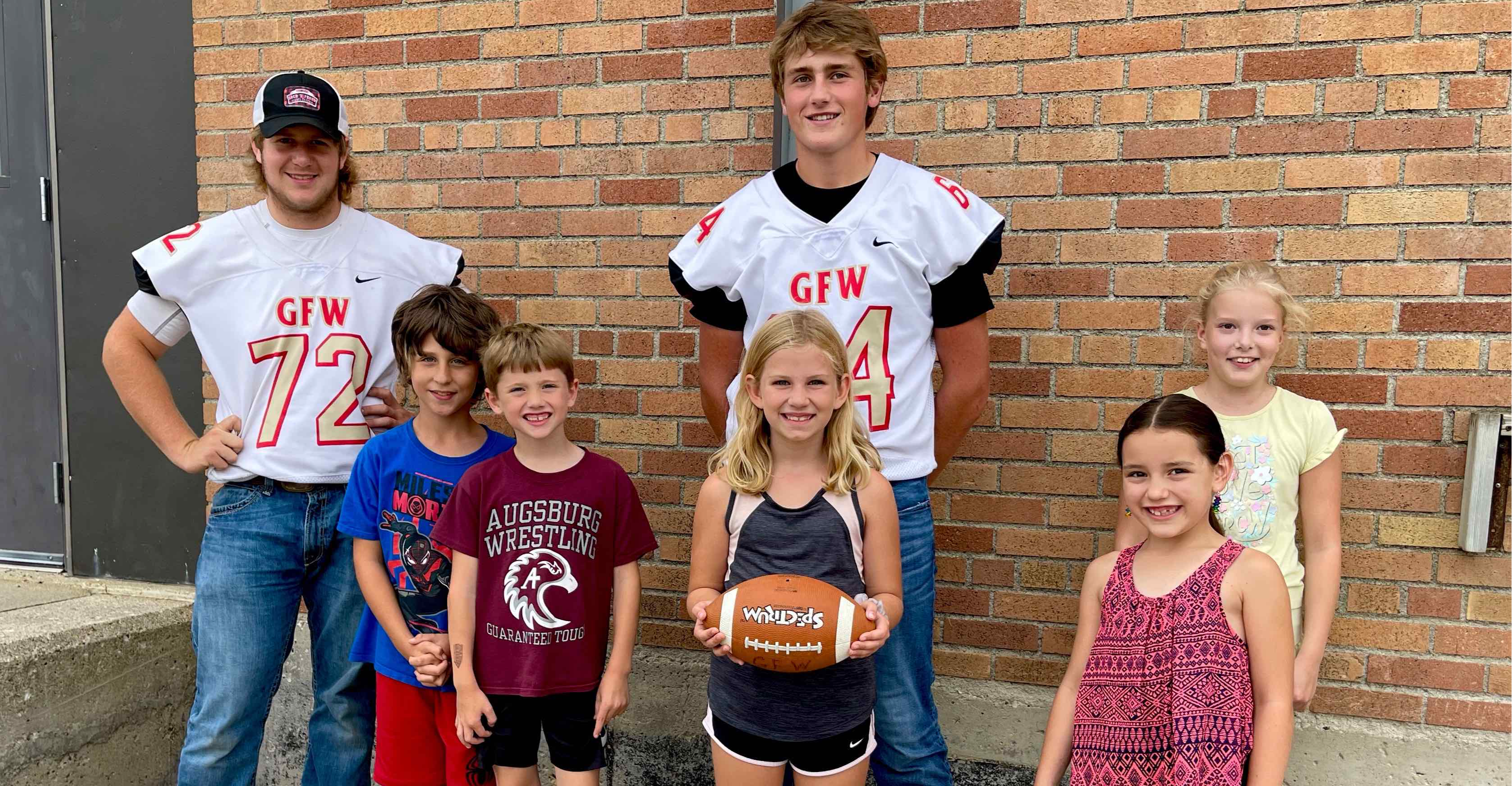 GFW football players with Elementary students